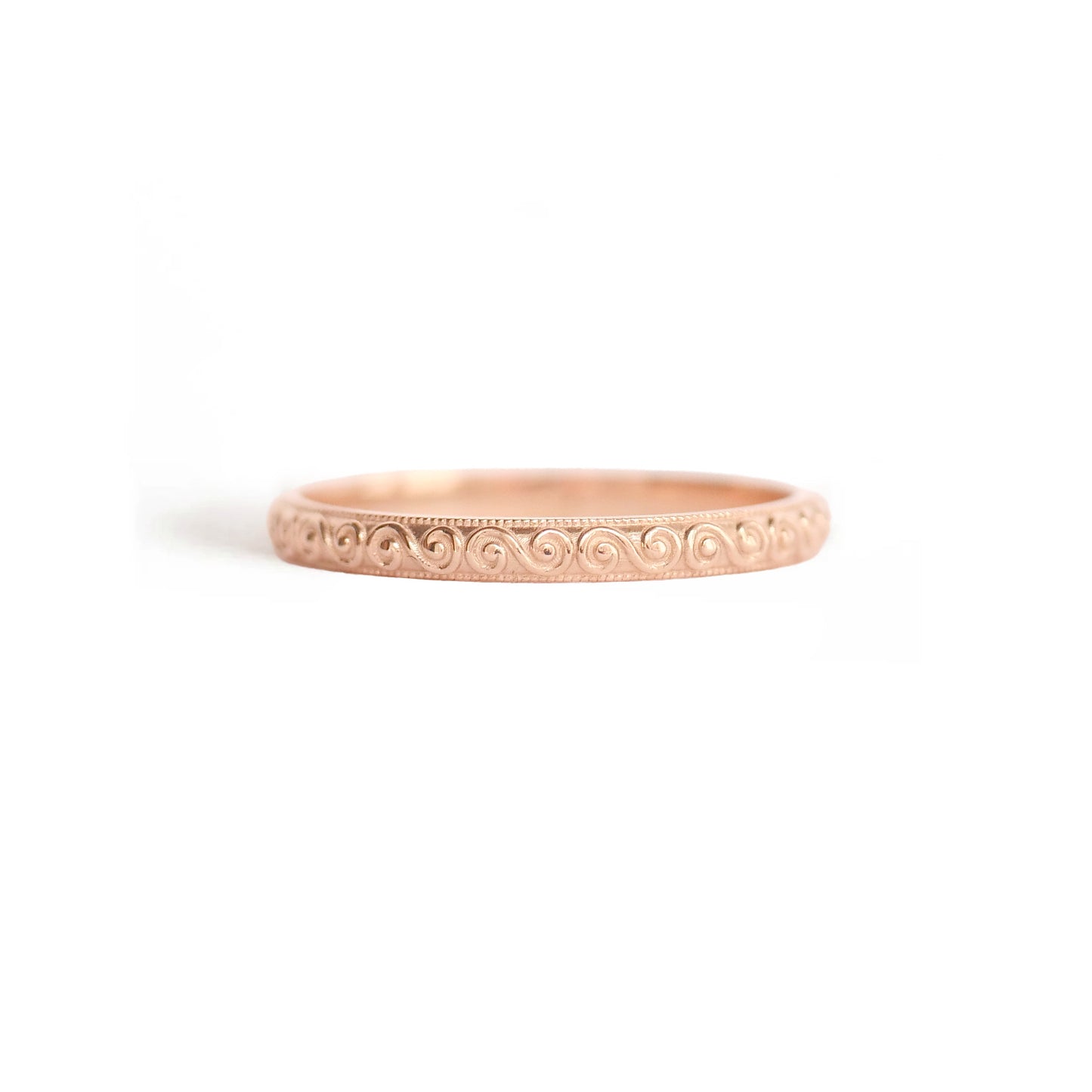 14k rose gold spiral wind wedding stacking band.