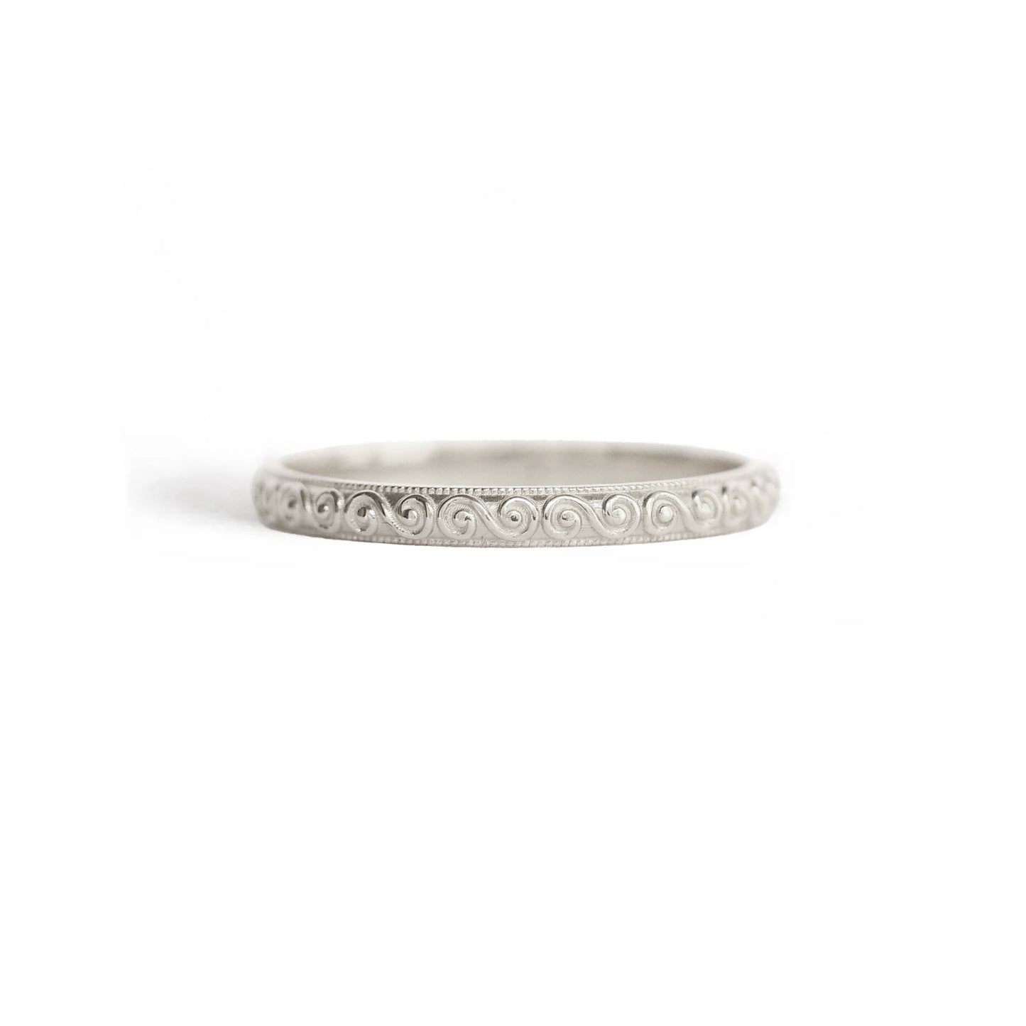 14k white gold wedding band with engraved wind spiral design.