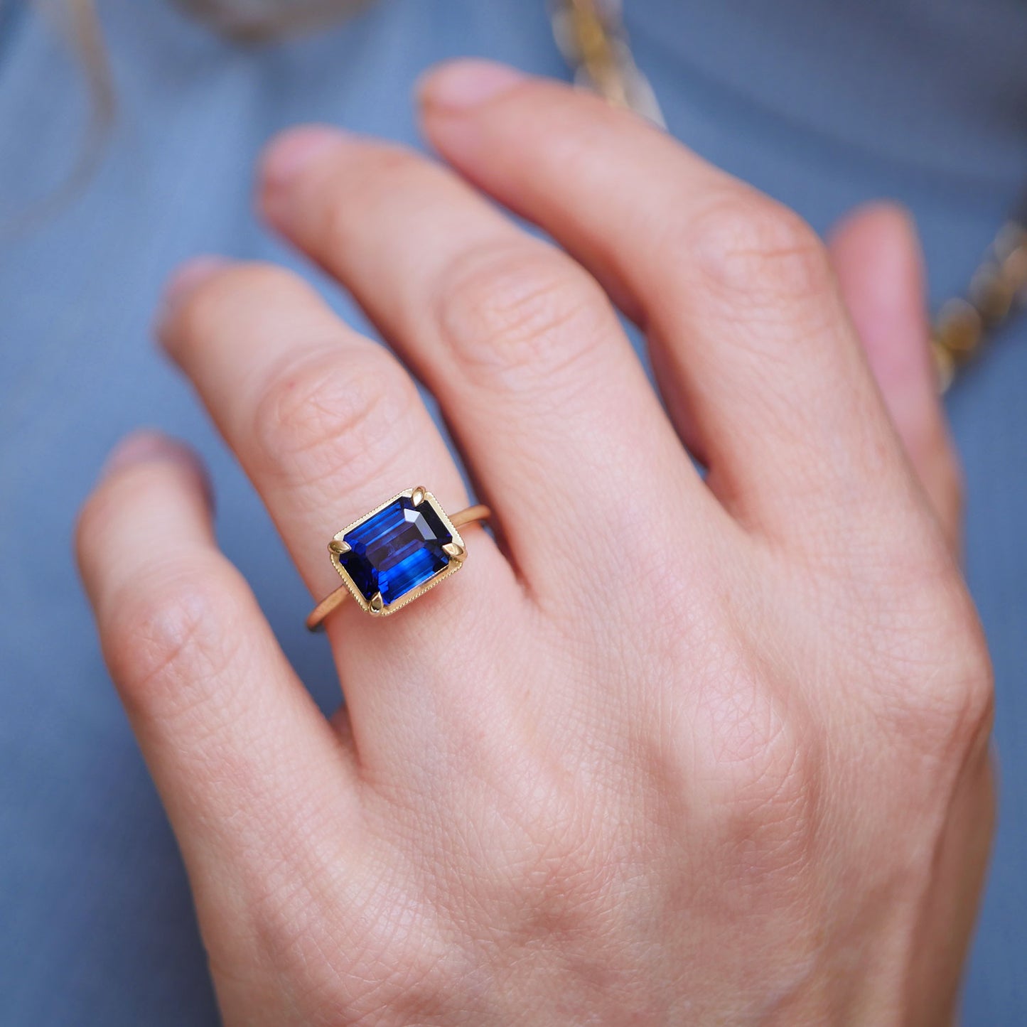 East West Emerald Cut Sapphire Solitaire