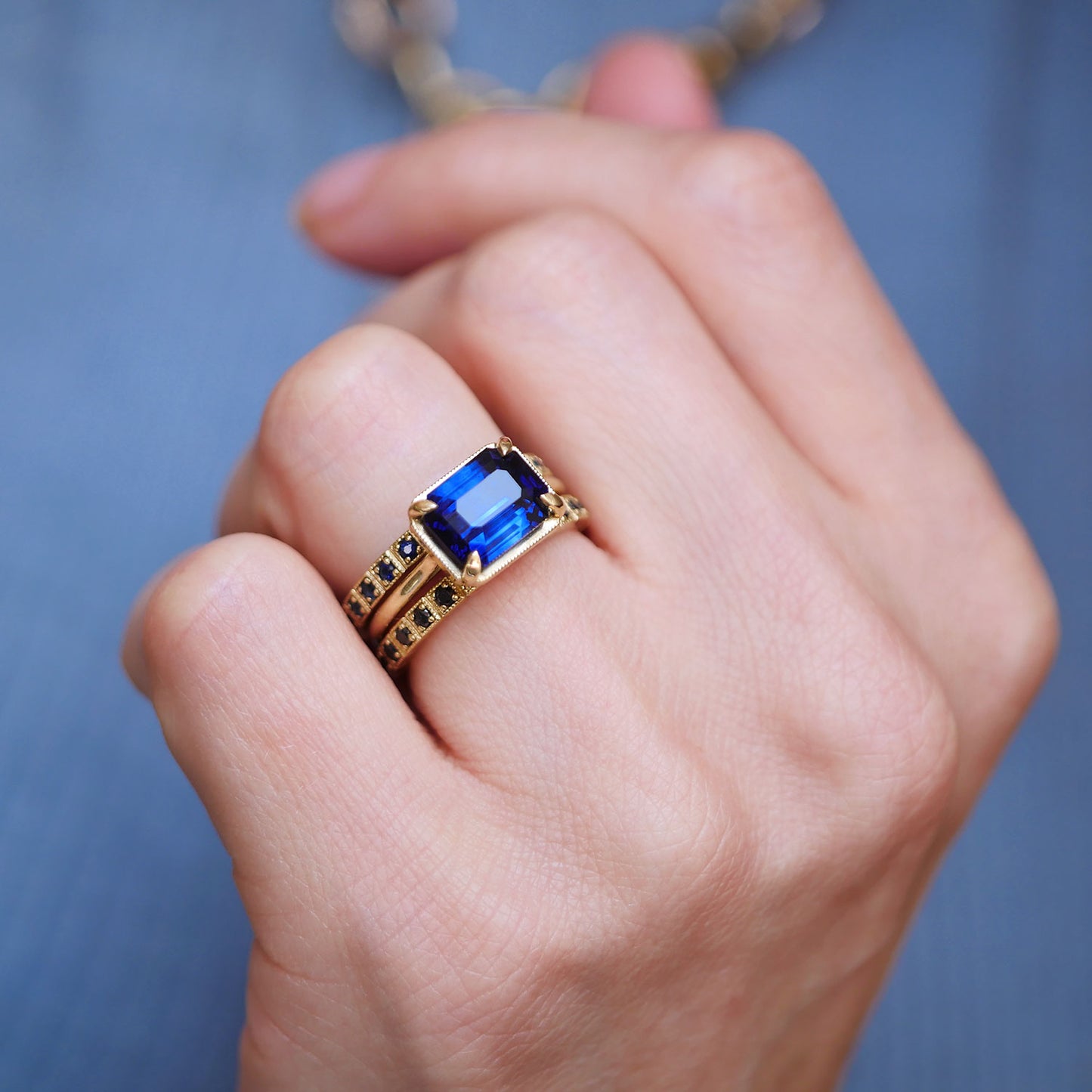 East West Emerald Cut Sapphire Solitaire