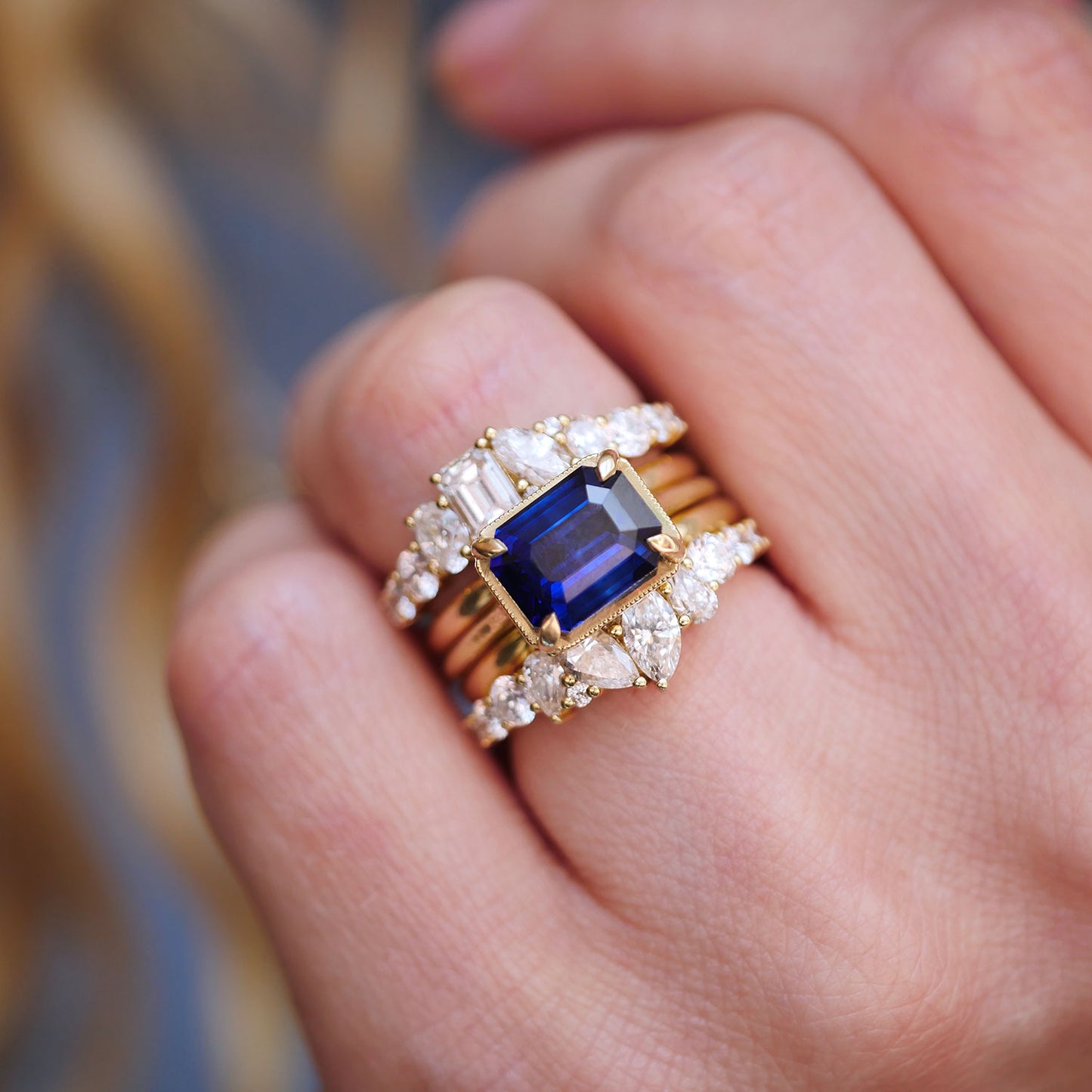 East West Emerald Cut Sapphire Solitaire