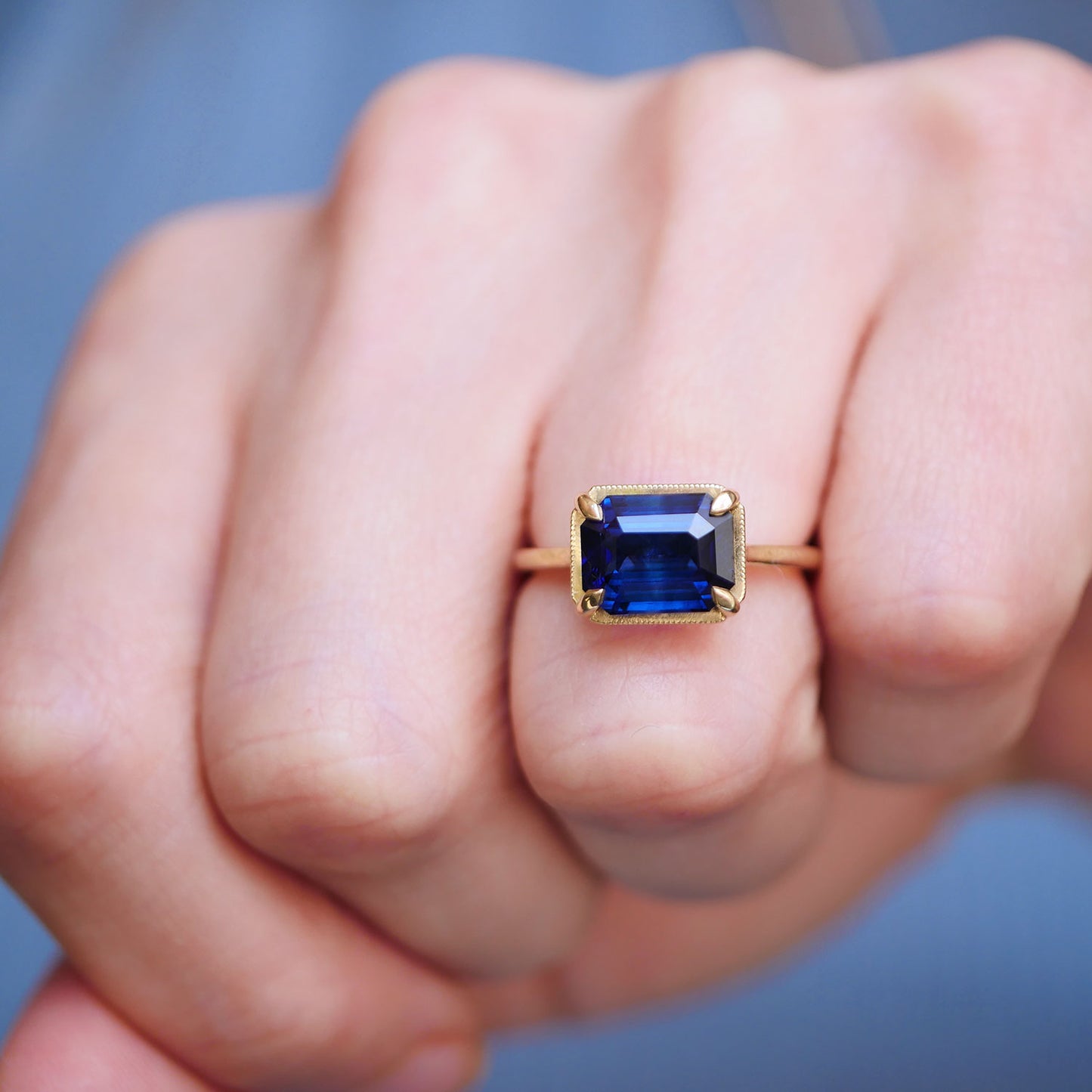 East West Emerald Cut Sapphire Solitaire