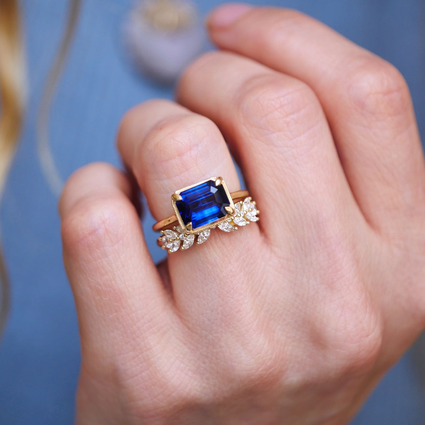 East West Emerald Cut Sapphire Solitaire