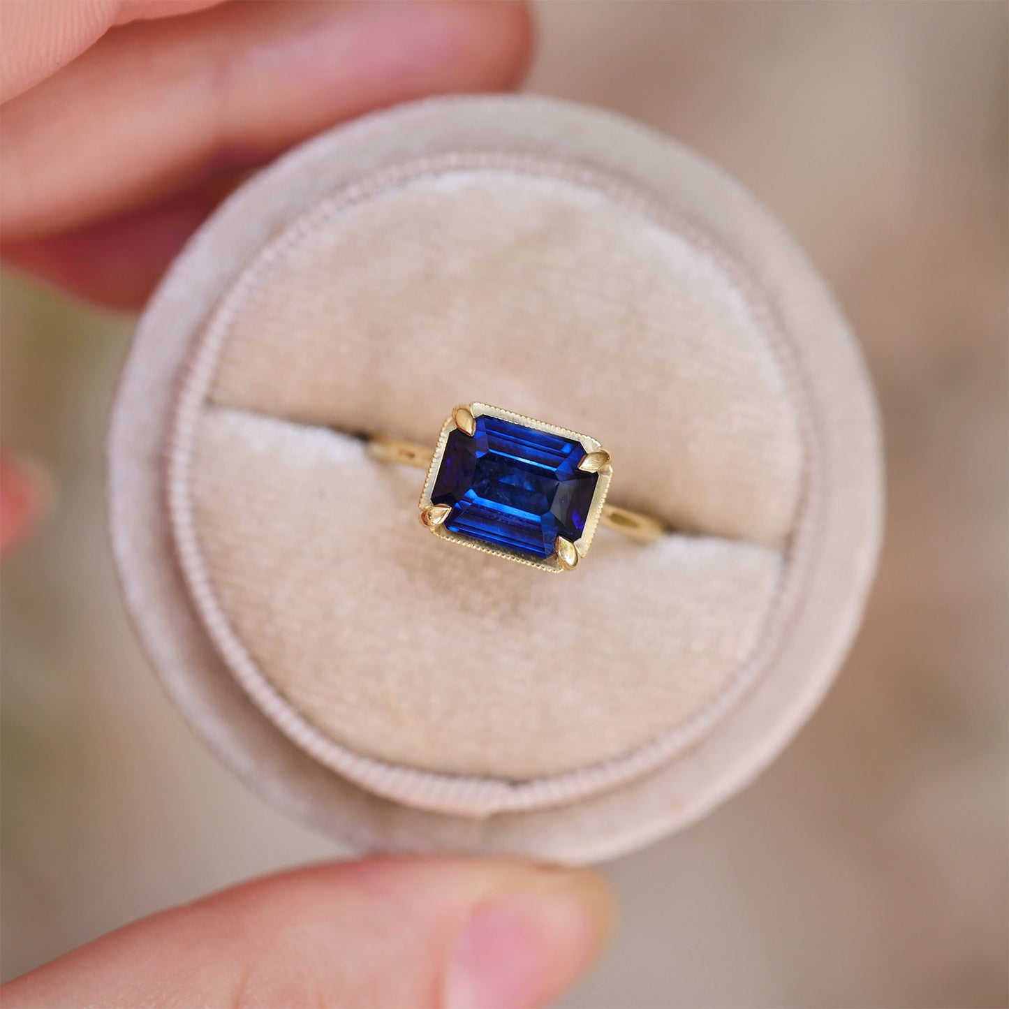 East West Emerald Cut Sapphire Solitaire