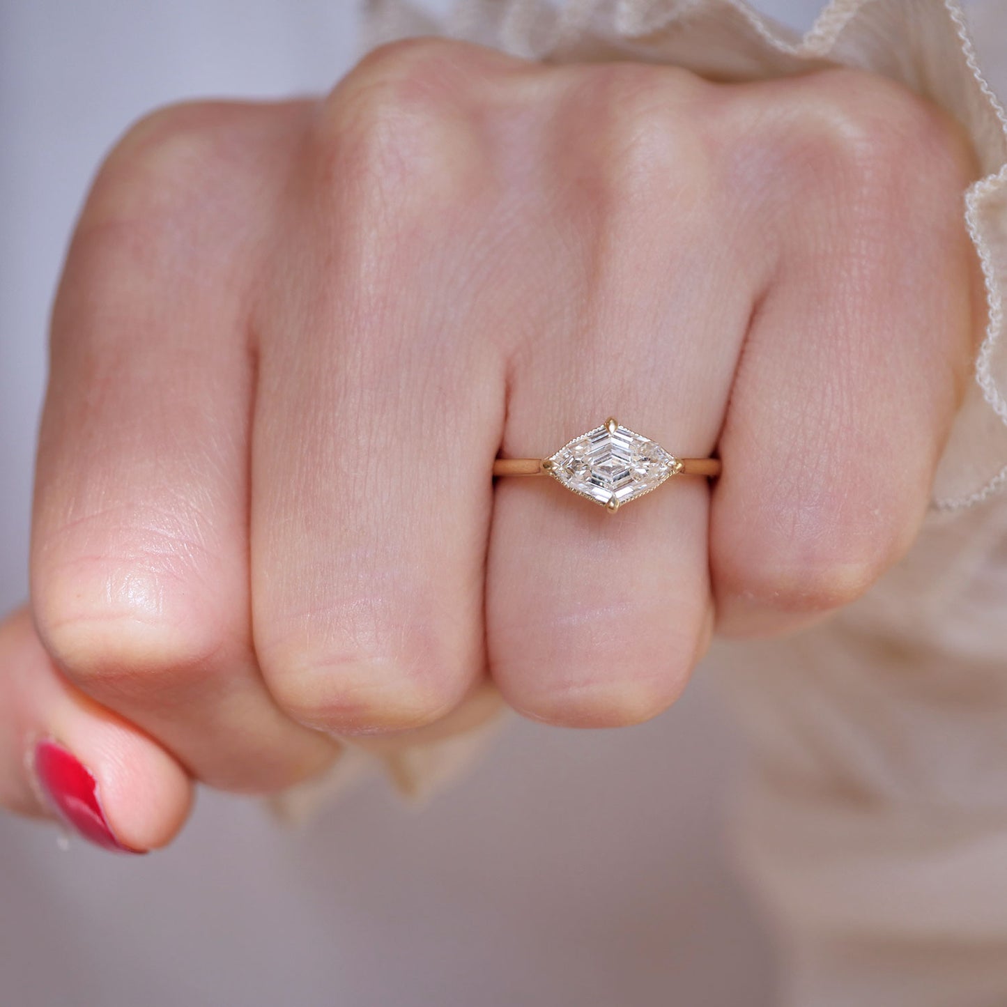 The center lozenge cut diamond engagement ring is a sophisticated and seamless fit for your special day.