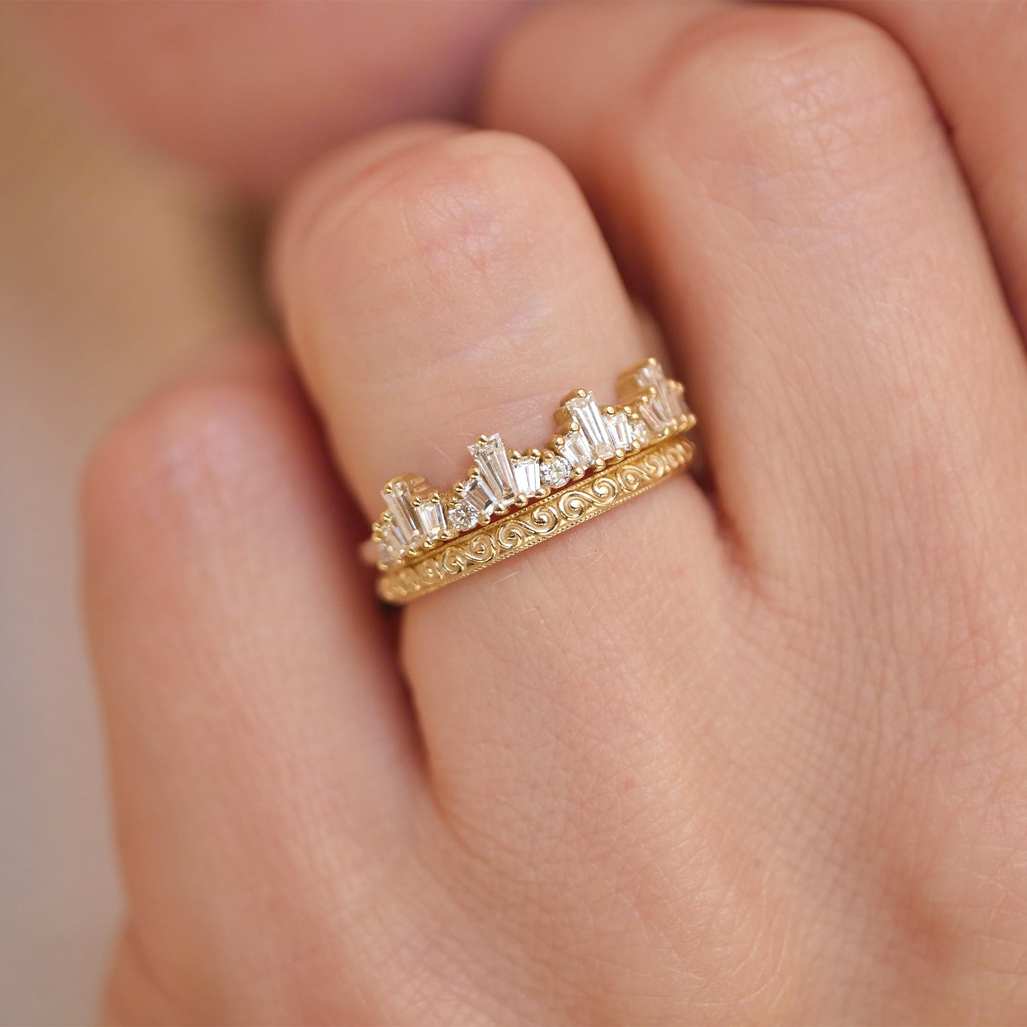 14k yellow gold and baguette diamond tiara engament ring stacked with wind spiral wedding band