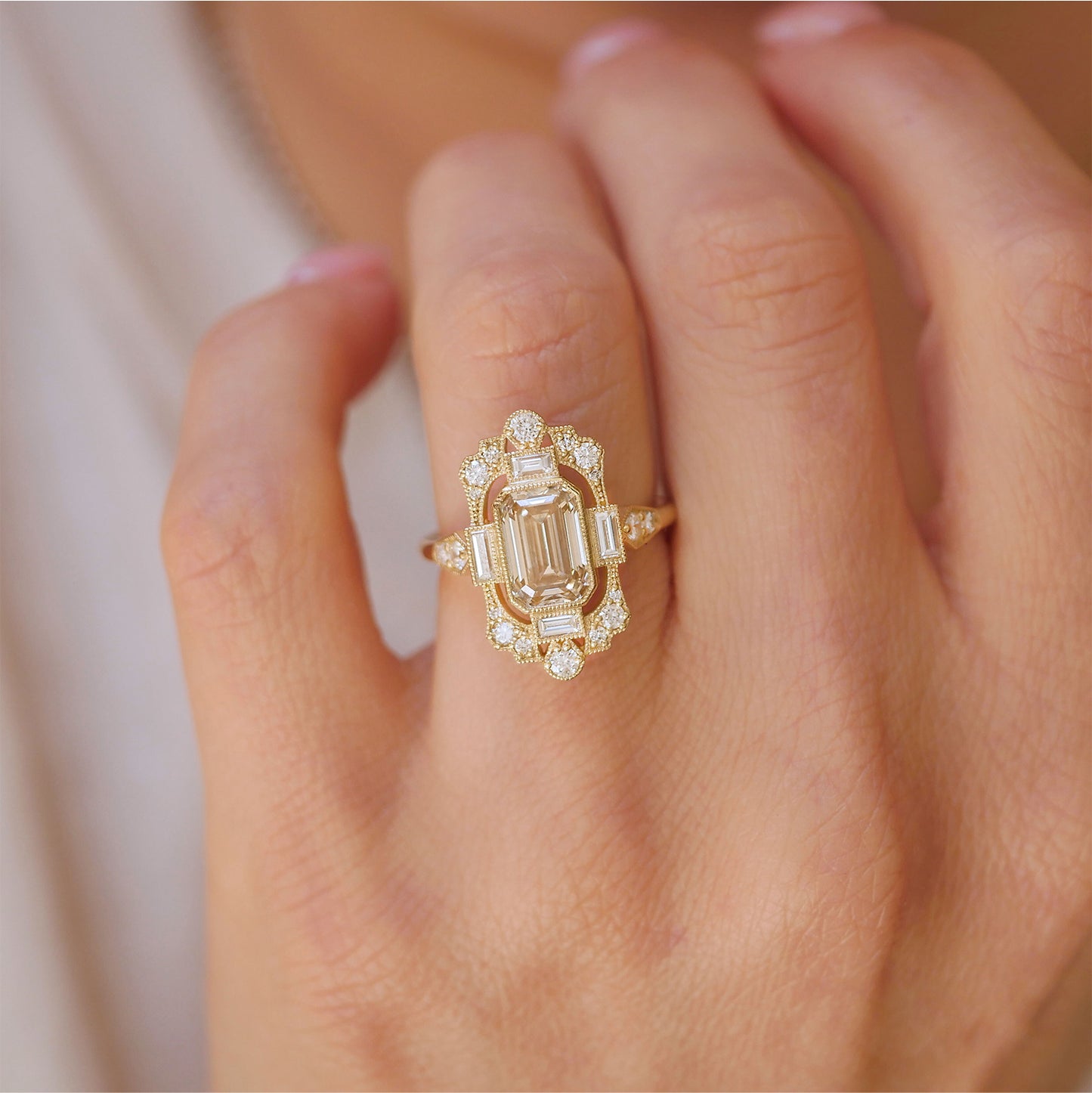 woman wearing vintage inspired fairmont engagement ring with champagne center diamond