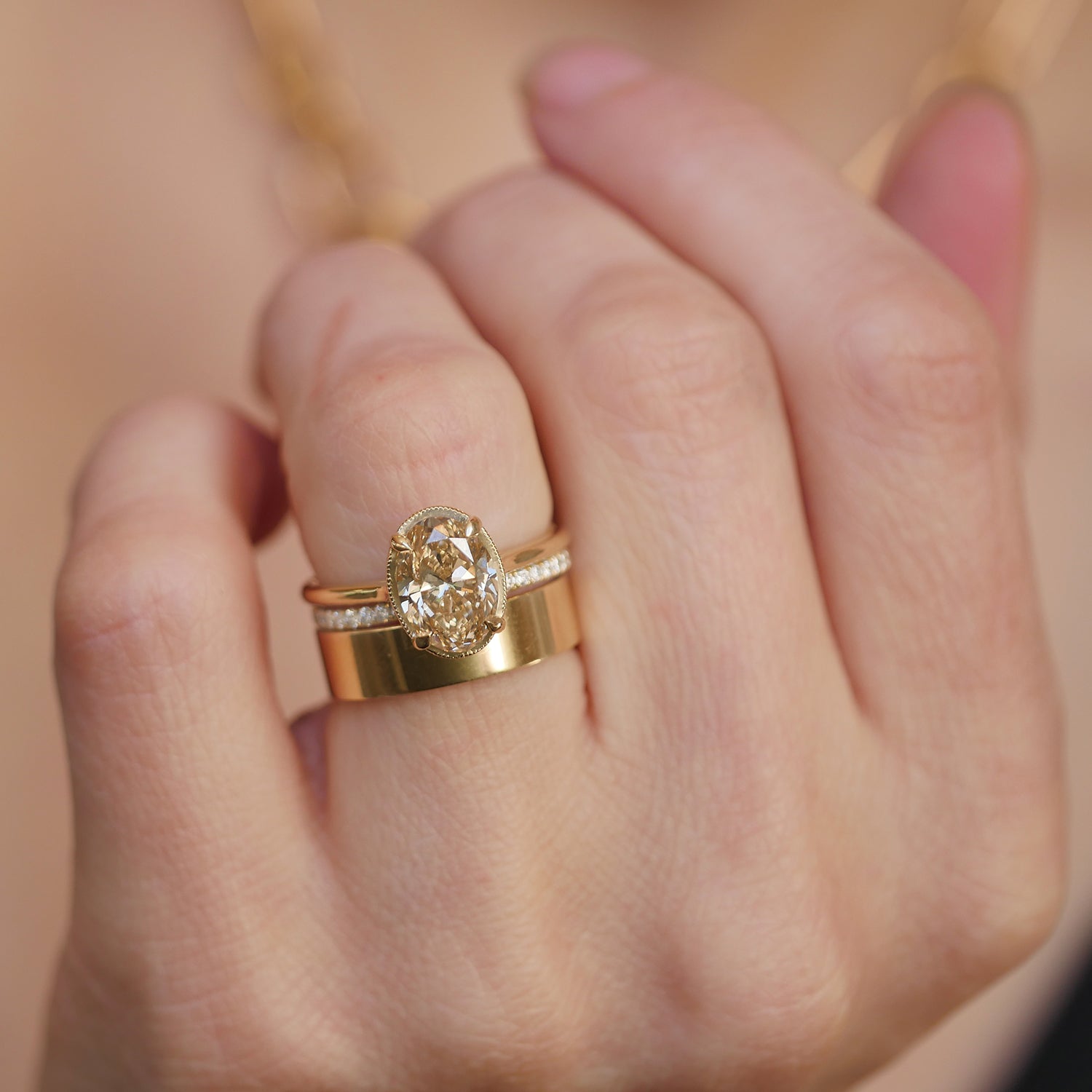 Antique inspired champagne diamond engagement ring with gold and diamond stacking bands