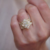A woman wearing a collection of vintage-inspired diamond engagement ring and wedding rings with natural diamonds.