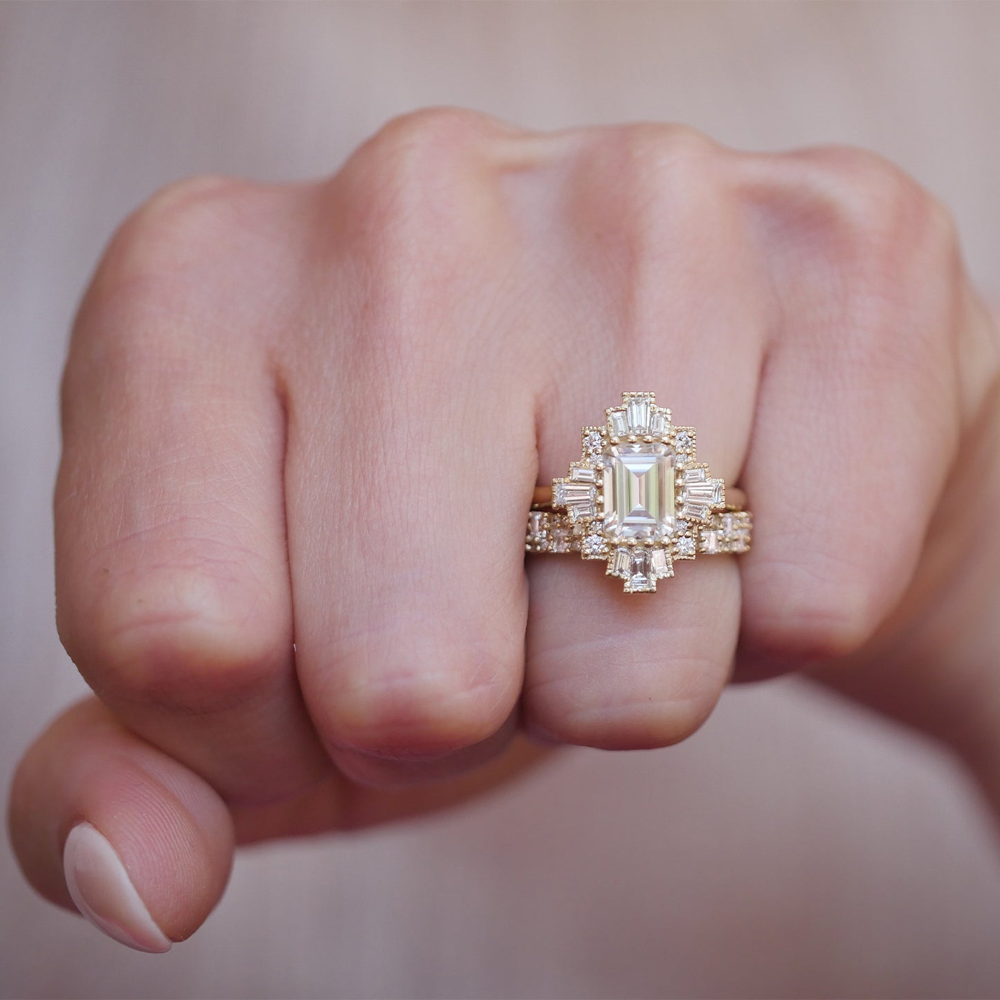 14k yellow gold deco moissanite and diamond engagement ring paired with the deco brick diamond band