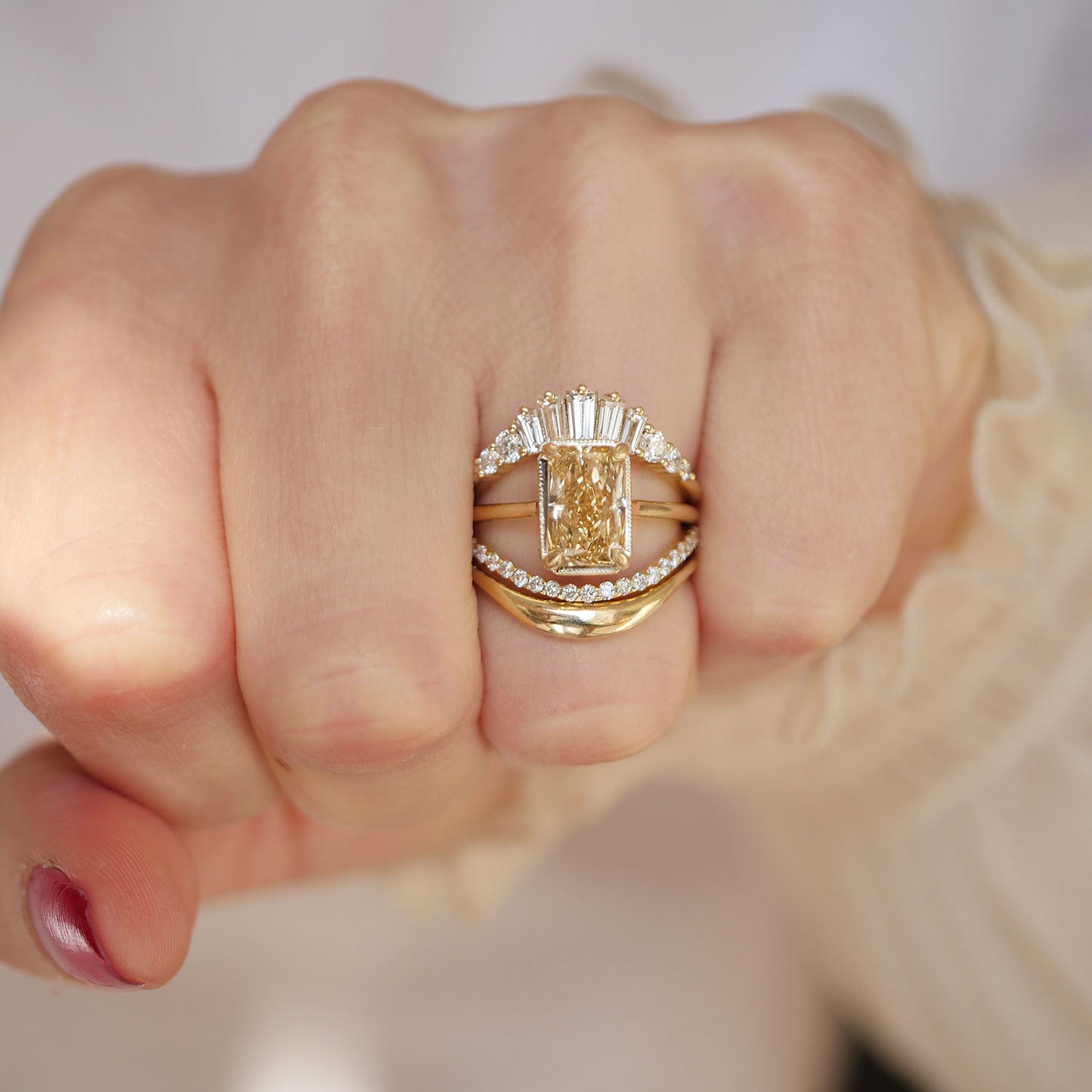 Radiant art deco solitaire stacked with baguette, round and gold contour band