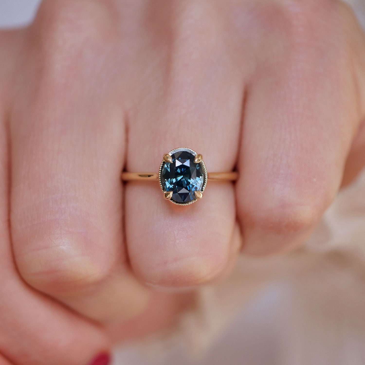 Unique oval shaped sapphire solitaire
