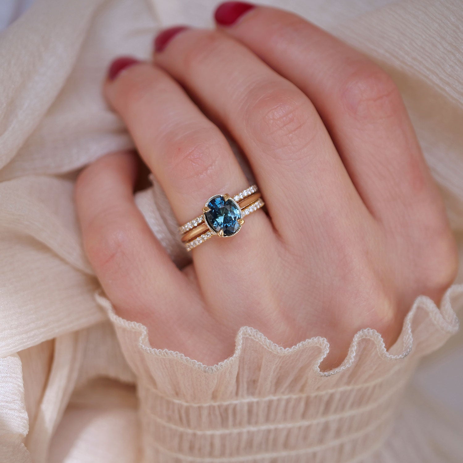 one of a kind oval shaped teal solitaire and stacked pave diamond band