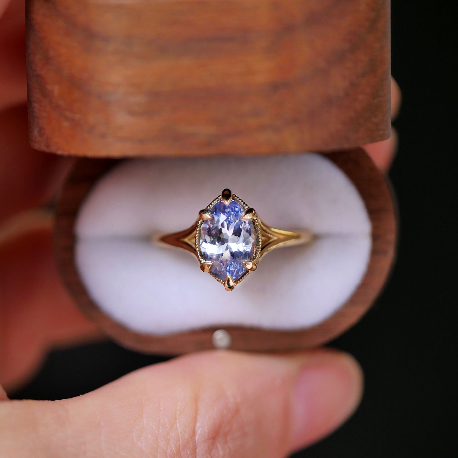 vintage wood box with one of a kind split shank marquise sapphire solitaire