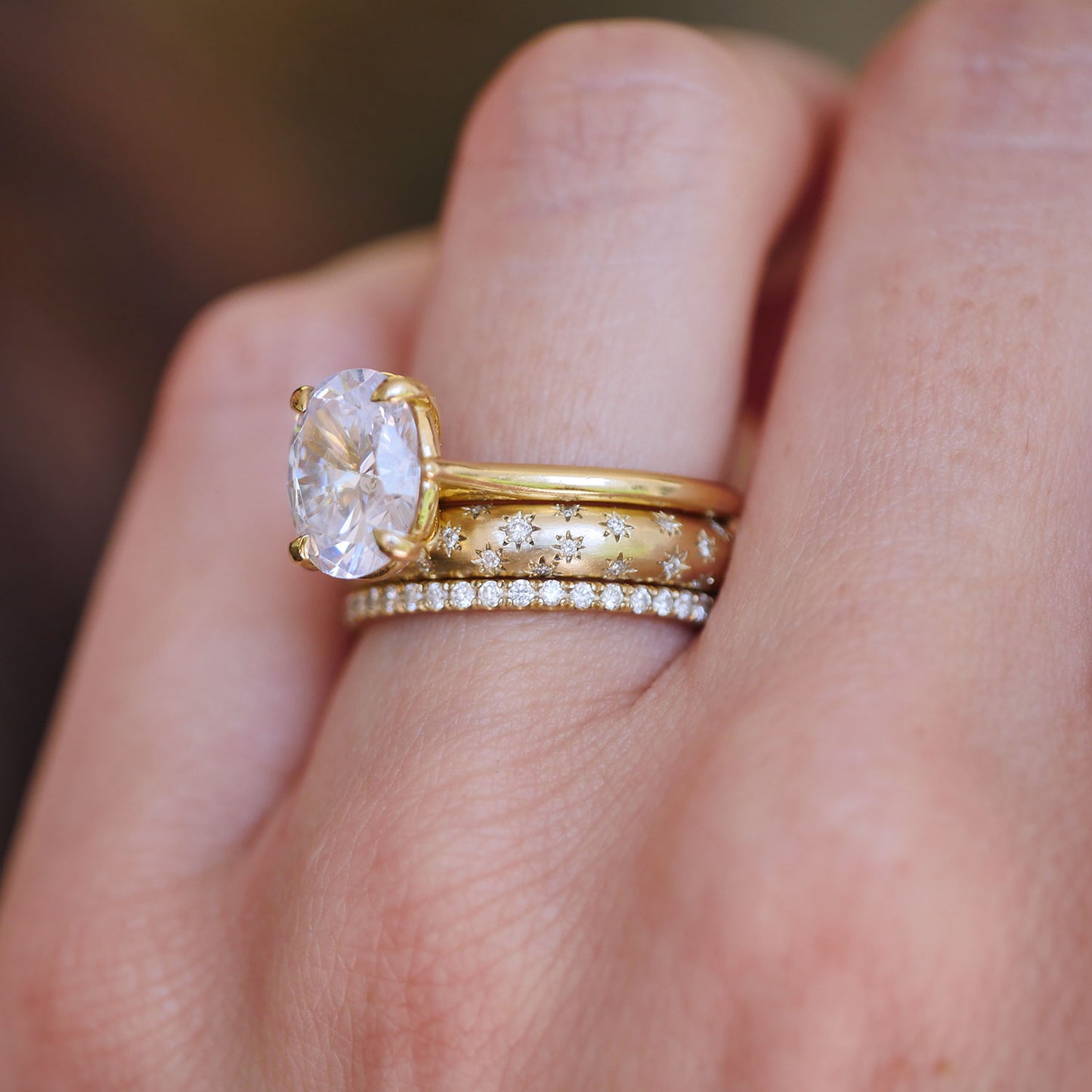 14k yellow gold engagment solitaire ring with star engraved diamond band and pave diamond ring