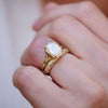 14k yellow gold emerald cut solitaire ring with a diamond star engraved wedding band