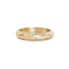 Gold ring with embedded diamonds on engraved stars