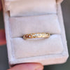 star engraved ring with embedded diamonds in a ring box