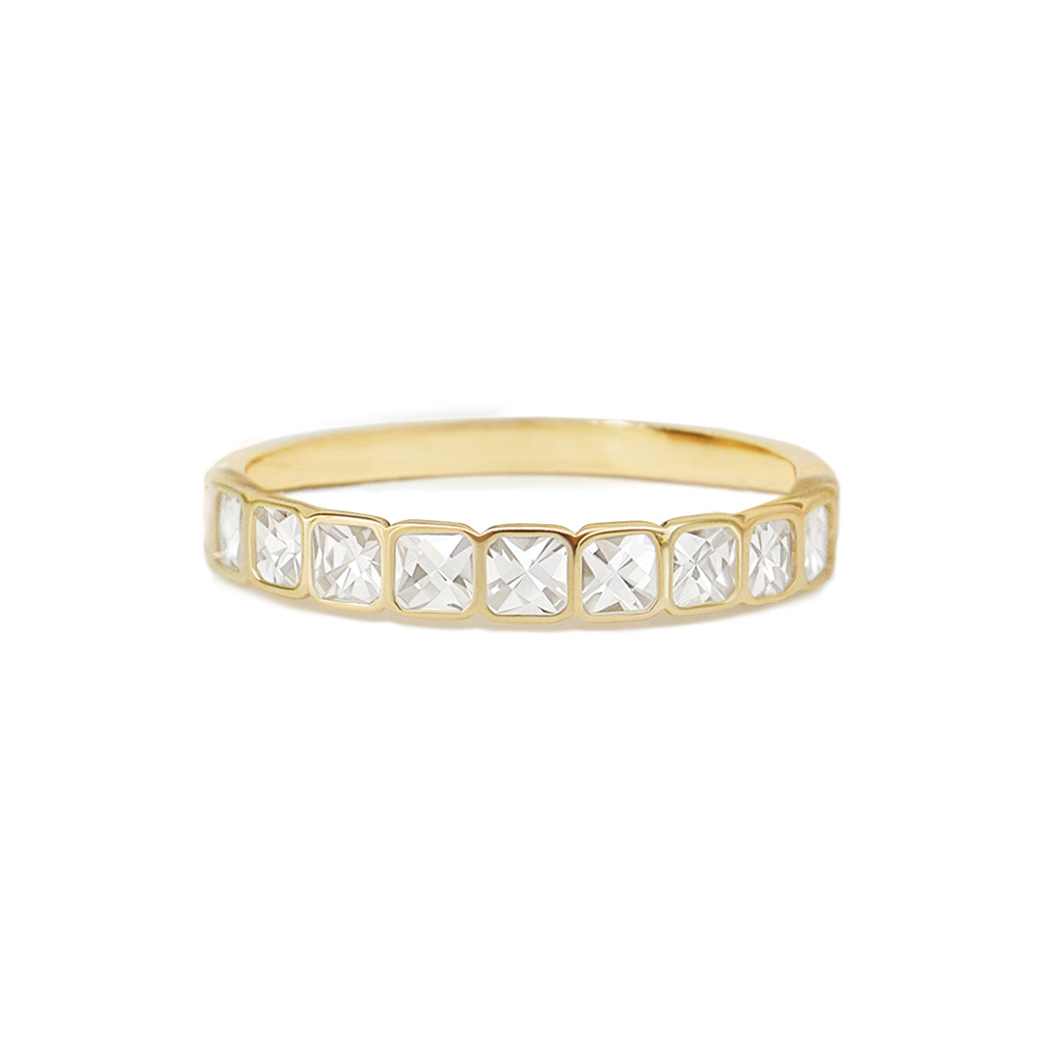 The French Cut Diamond Bezel Band showcases an elegant design where each diamond is meticulously set within a sleek bezel, creating a sophisticated and modern aesthetic.