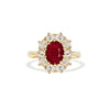 A 14k yellow gold cluster ring with ruby center and surrounding diamonds.