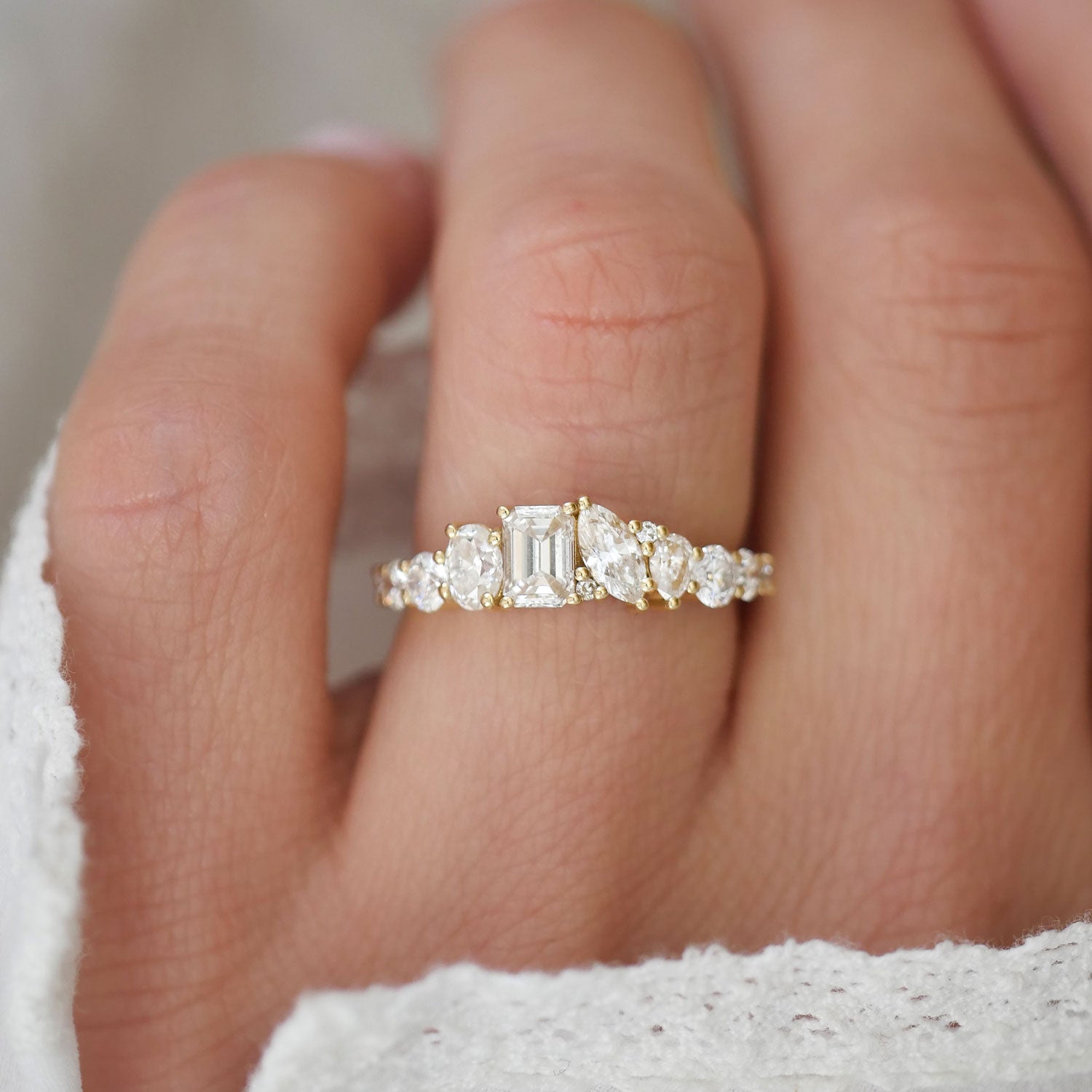 This exquisite band features an intricate mosaic of emerald and marquise diamonds, arranged to form a dazzling, firework-inspired pattern that radiates sophistication.