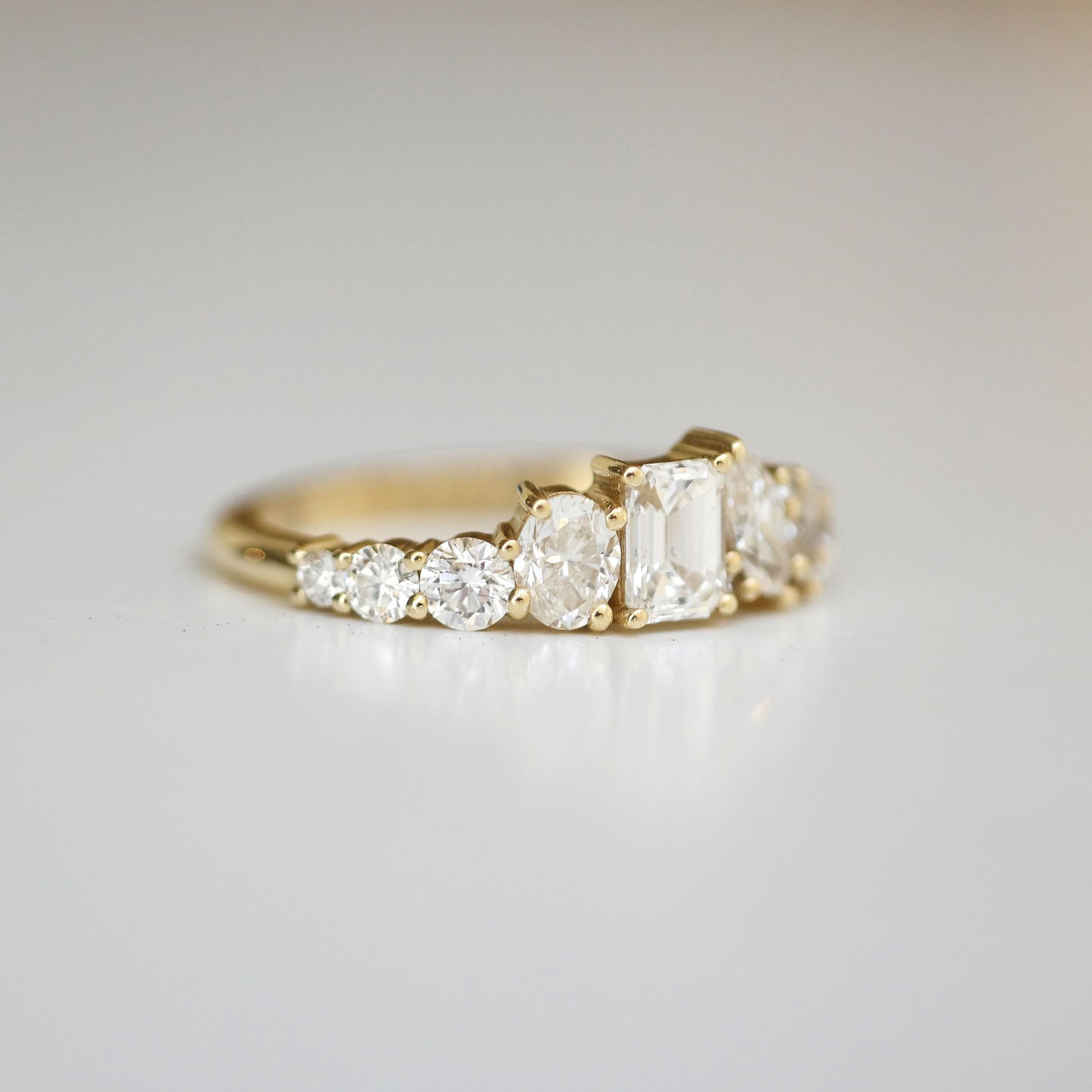 With its bold, geometric design, the Emerald & Marquise Firework Diamond Mosaic Band offers a modern twist on classic diamond cuts, perfect for those seeking a piece that's both contemporary and luxurious.