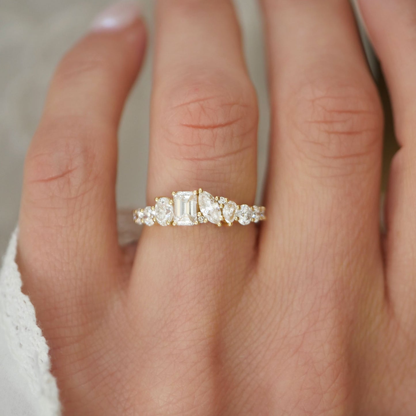 The Emerald & Marquise Firework Diamond Mosaic Band offers a brilliant fusion of sharp emerald cuts and delicate marquise diamonds, arranged in a captivating mosaic that delivers both elegance and firework-like brilliance.