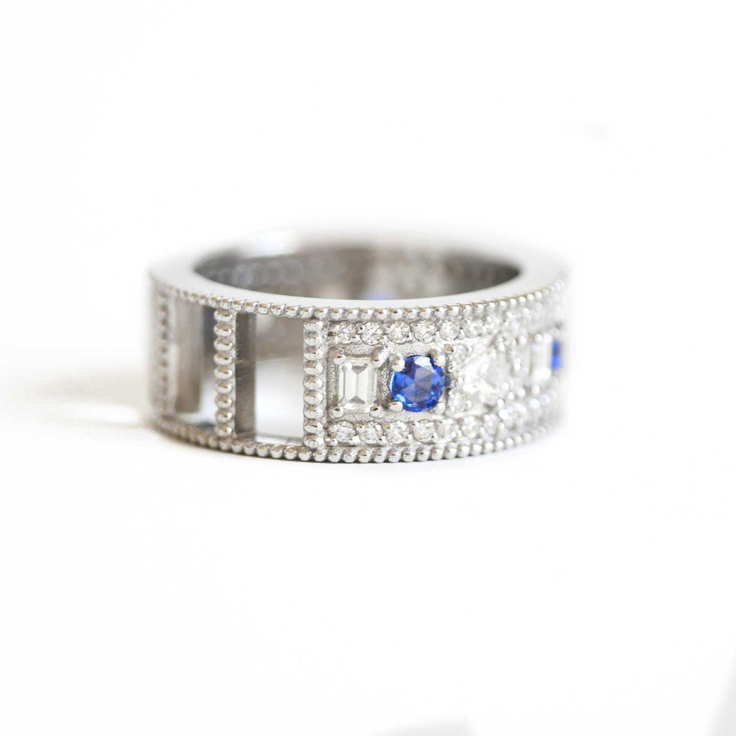 Custom East West Oval Rose Cut Ring with 3/4 diamond pattern & Cylon Sapphires