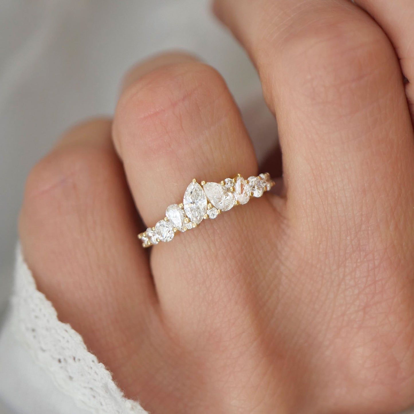This stunning band showcases a unique mosaic of diamonds that bursts with brilliance, mimicking the excitement and energy of a celebratory firework display.