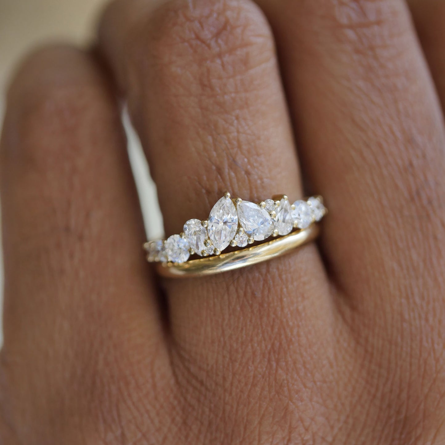 The elegant pear and marquise diamonds are artfully set to catch the light from every angle, offering a bold, yet timeless piece perfect for any occasion.