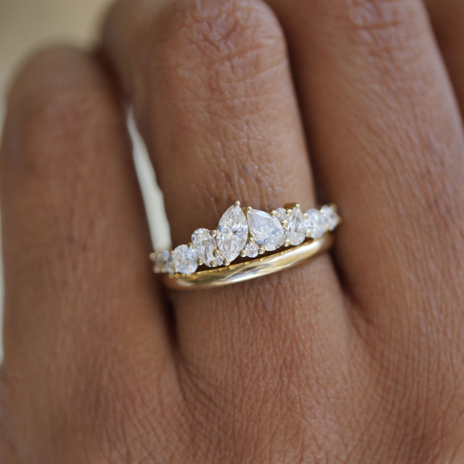 The elegant pear and marquise diamonds are artfully set to catch the light from every angle, offering a bold, yet timeless piece perfect for any occasion.