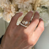 The graceful pear shape of the champagne diamond is designed to capture light from every angle, making it a radiant and unforgettable centerpiece in this toi et moi ring. Stacked with diamond wedding band.