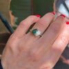 The pear-shaped emerald adds a touch of vivid luxury, while the brilliant diamond enhances the ring’s overall sparkle, making it a perfect representation of two souls intertwined.